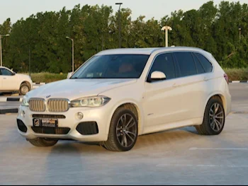  BMW  X-Series  X5 M  2014  Automatic  138,000 Km  8 Cylinder  Four Wheel Drive (4WD)  SUV  White  With Warranty