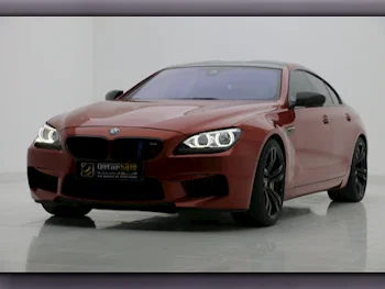 BMW  M-Series  6  2014  Automatic  144,000 Km  8 Cylinder  Rear Wheel Drive (RWD)  Sedan  Orange