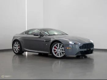  Aston Martin  Vantage  2015  Automatic  14,500 Km  8 Cylinder  Rear Wheel Drive (RWD)  Coupe / Sport  Gray  With Warranty
