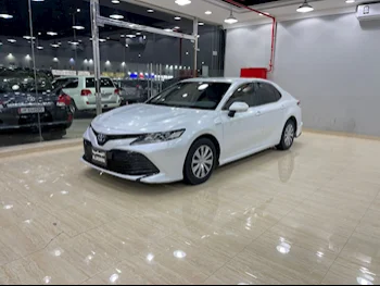 Toyota  Camry  Hybrid  2020  Automatic  245,000 Km  4 Cylinder  Front Wheel Drive (FWD)  Sedan  White