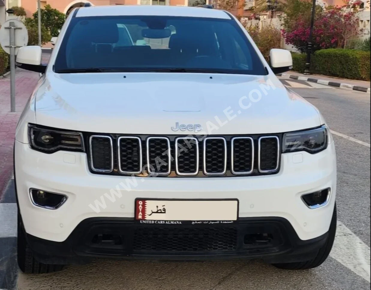 Jeep  Grand Cherokee  Laredo  2021  Automatic  23,700 Km  6 Cylinder  Four Wheel Drive (4WD)  SUV  White  With Warranty
