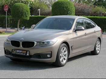 BMW  3-Series  320i GT  2015  Automatic  99,000 Km  4 Cylinder  Rear Wheel Drive (RWD)  Sedan  Gold