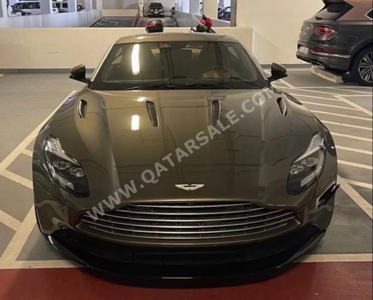 Aston Martin  DB  11  2017  Automatic  11,000 Km  12 Cylinder  Rear Wheel Drive (RWD)  Coupe / Sport  Gold  With Warranty