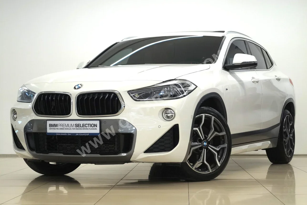 BMW  X-Series  X2  2021  Automatic  30٬600 Km  4 Cylinder  Front Wheel Drive (FWD)  SUV  White  With Warranty
