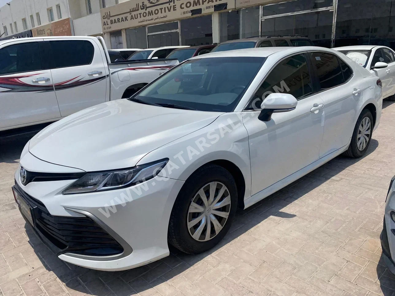 Toyota  Camry  LE  2021  Automatic  64,000 Km  4 Cylinder  Front Wheel Drive (FWD)  Sedan  White