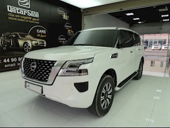 Nissan  Patrol  2022  Automatic  15,500 Km  6 Cylinder  Four Wheel Drive (4WD)  SUV  White  With Warranty