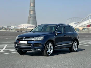 Volkswagen  Touareg  2014  Automatic  128٬000 Km  8 Cylinder  All Wheel Drive (AWD)  SUV  Blue