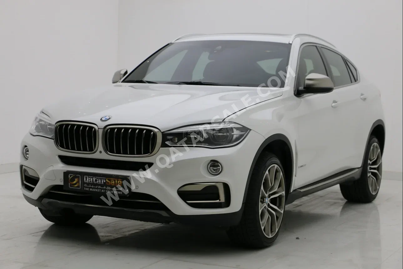 BMW  X-Series  X6 50i  2016  Automatic  143,000 Km  8 Cylinder  Four Wheel Drive (4WD)  SUV  White
