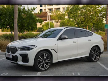 BMW  X-Series  X6 M50i  2022  Automatic  57٬000 Km  8 Cylinder  Four Wheel Drive (4WD)  SUV  White  With Warranty