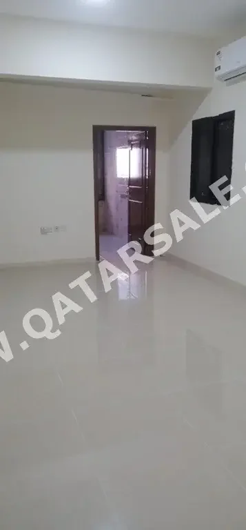 2 Bedrooms  Apartment  For Rent  in Doha -  Al Mansoura  Not Furnished